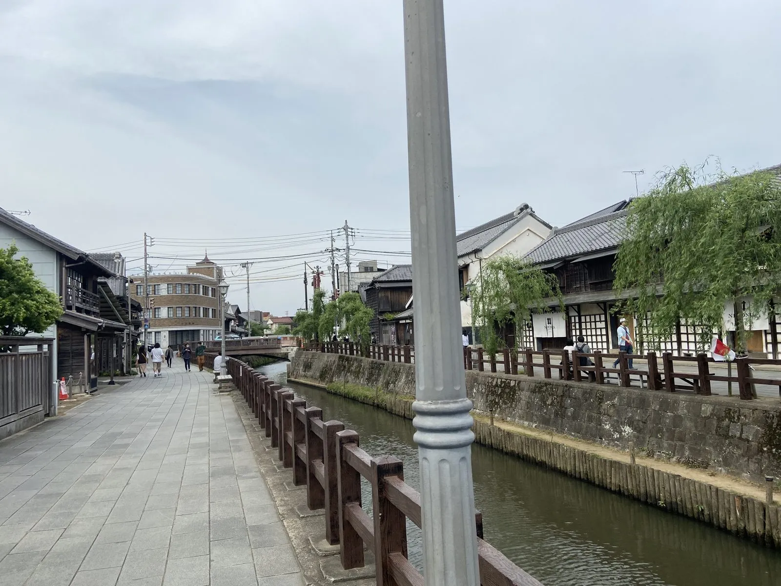 Canal-side walk in Sawara with willows and preserved buildings
