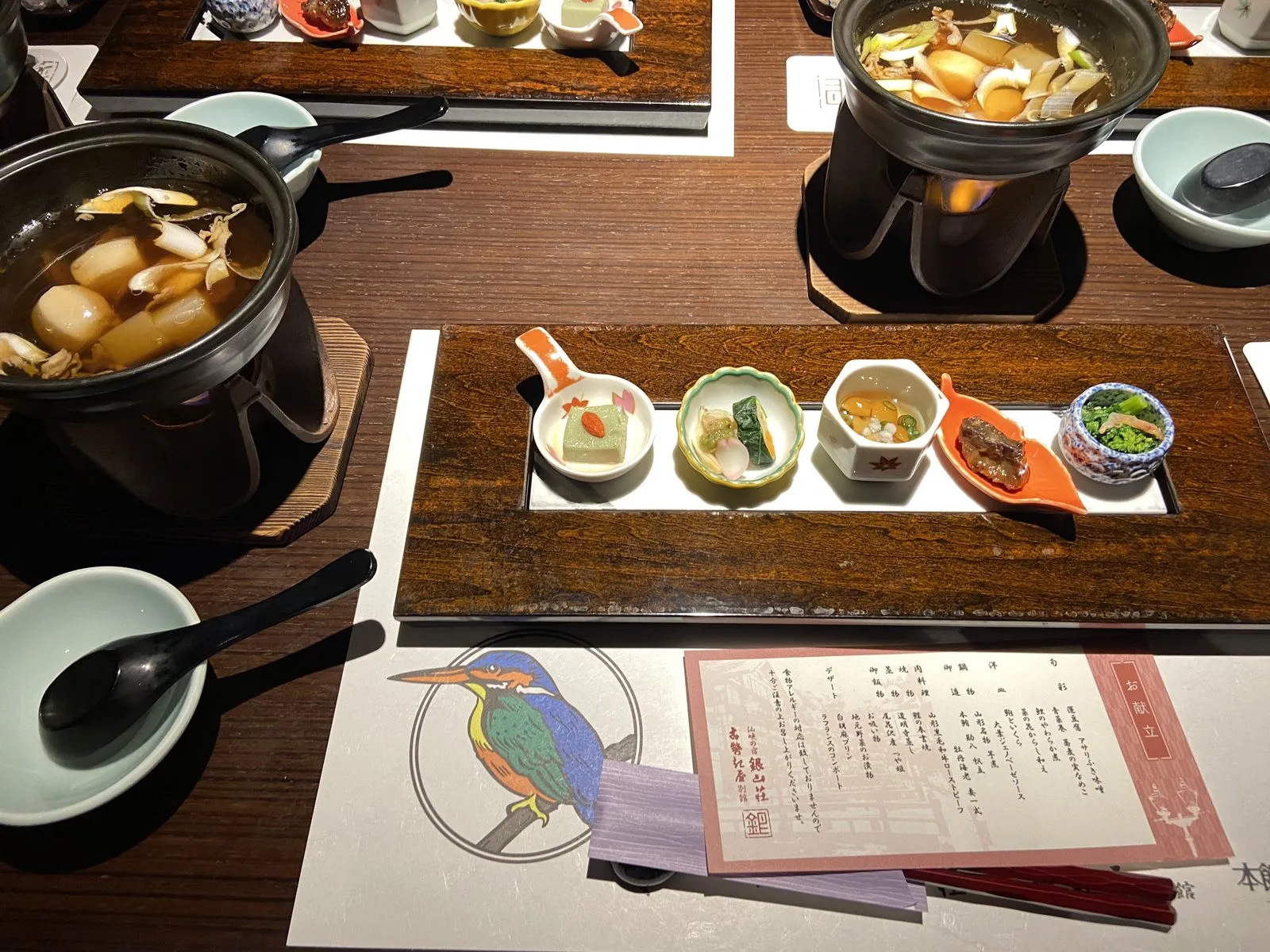 Kaiseki dinner at Kosekiya Bekkan: imoni hotpot over a flame and a row of small Yamagata appetizers